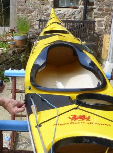 Black triangles on yellow kayak
