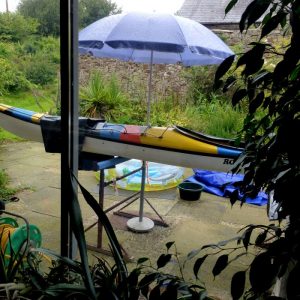 Kayak paint job under the umbrella